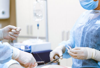 Photo of medical professionals wearing personal protective equipment